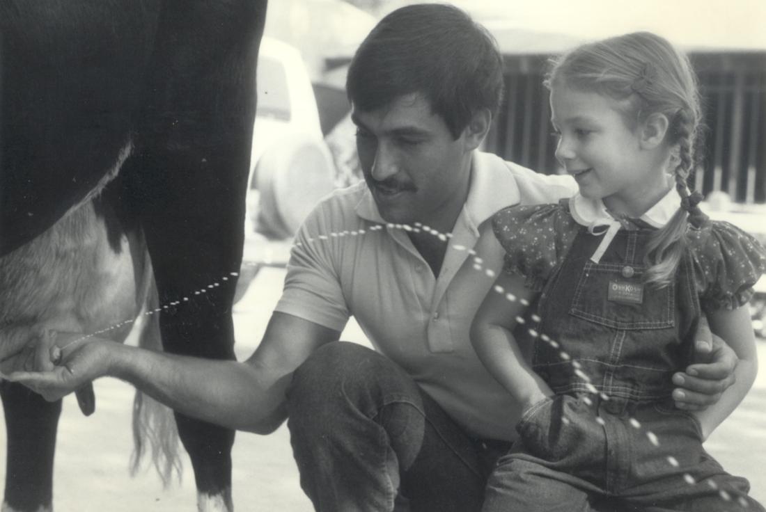 Man and Girl with a Milking Cow