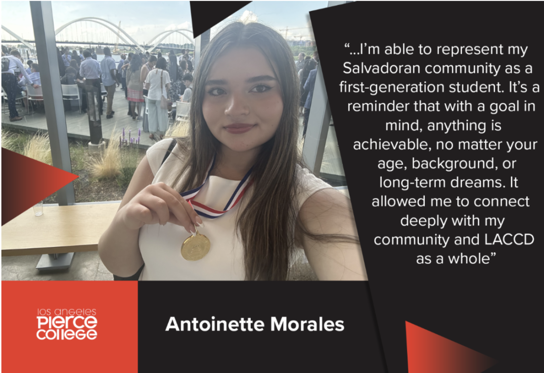 student holding medal