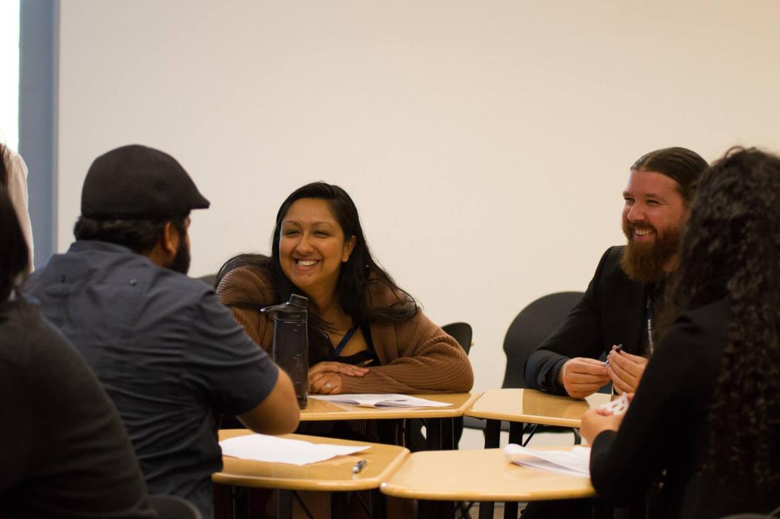 Students sitting at a table talking